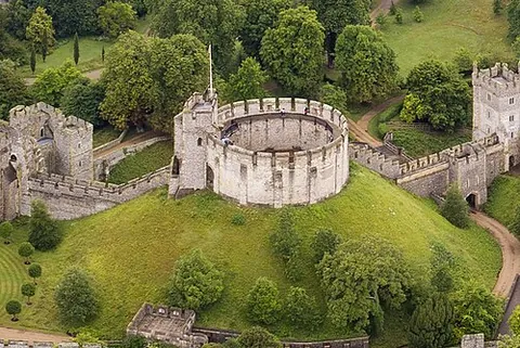 motte and bailey: the predecessor of the European castle, having a raised earth mound (the motte) topped with a tower...