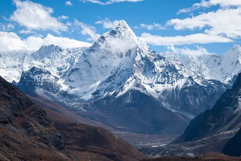 mountain: an elevation of land of considerable dimensions rising more or less abruptly, forming a conspicuous...