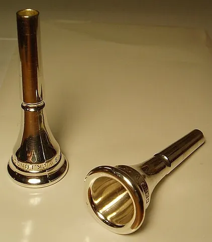 mouthpiece: the part of a telephone that is held close to the mouth