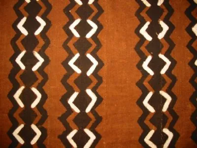 mudcloth: a hand-made Malian cotton fabric, traditionally dyed with fermented mud