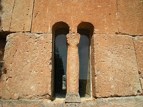 mullion: a vertical bar between the panes of glass or casements of a window or the panels of a screen