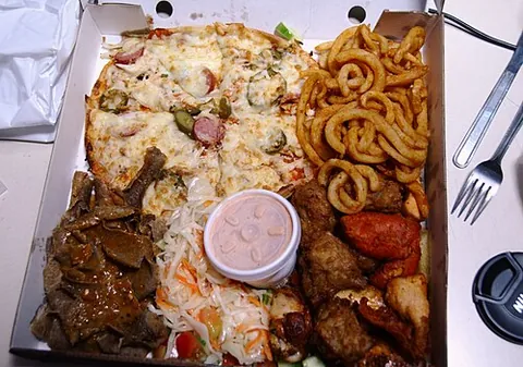 munchie box: an assortment of fast foods, pizza, fries, doner kebab meat, etc., sold together in a large flat box