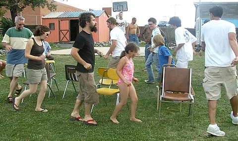 musical chairs: a children's game in which players circle a group of chairs. There is one chair fewer than the...