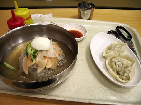naengmyeon: a Korean dish of long, thin hand-made noodles made from flour and starch from various ingredients