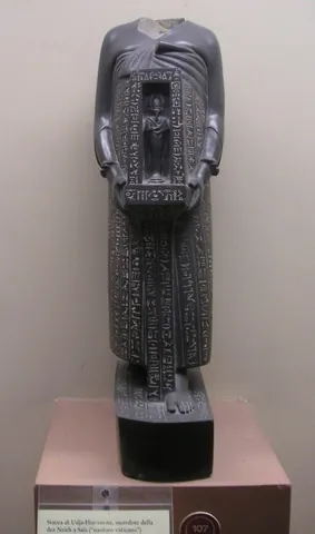 naophorous: carrying a naos