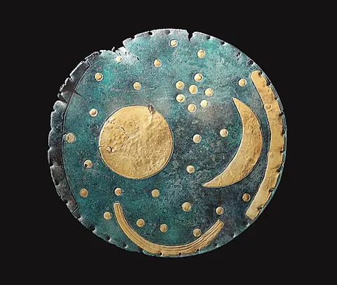 nebra sky disc: a bronze disc featuring gold symbols inlaid on a blue-green patina, generally interpreted as...