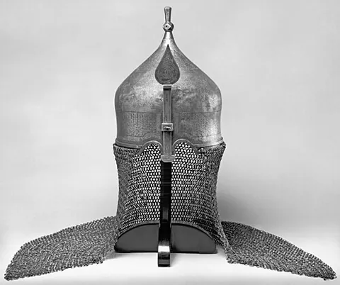 neck guard: a piece of armor or protective equipment which protects the neck