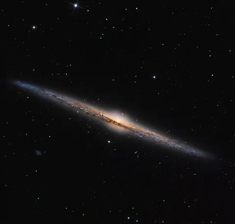 needle galaxy: a spiral galaxy, NGC designation NGC 4565, in the Coma Berenices