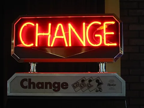neon sign: an illuminated sign constructed from fluorescent lights in the form of bent glass tubes; the...