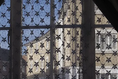 net curtain: a thin curtain that allows light into a room but prevents people outside from seeing inside