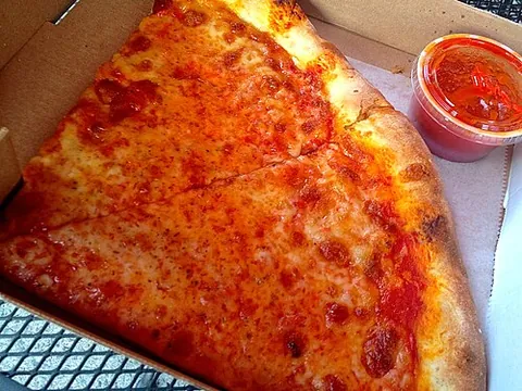 new york-style pizza: a pizza with a thick crispy outer bread crust, and thin soft bread base