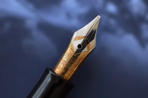 nib: the tip of a pen or tool that touches the surface, transferring ink to paper