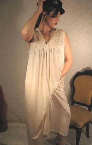nightgown: a long loose robe worn mainly by women for sleeping in