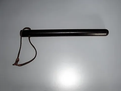 nightstick: a long, narrow, polelike club carried by police and security personnel, for use in self-defense
