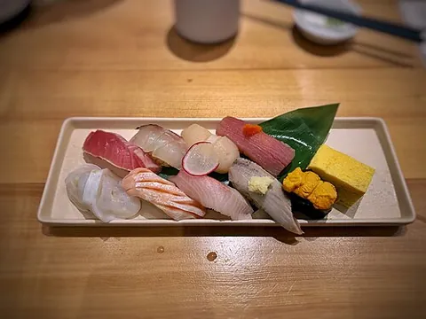 nigiri: regular sushi: a piece of raw fish (or other topping) on top of a small oblong brick of sticky...