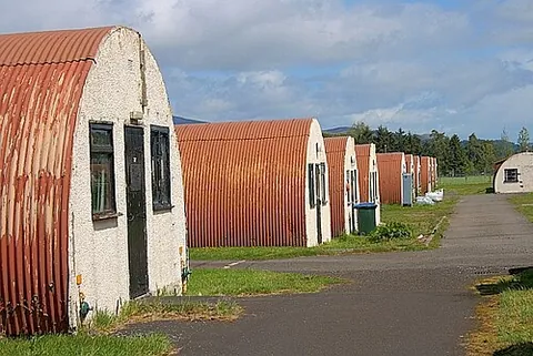 nissen hut: a prefabricated building, formerly used by the military, having a semicircular roof of corrugated...