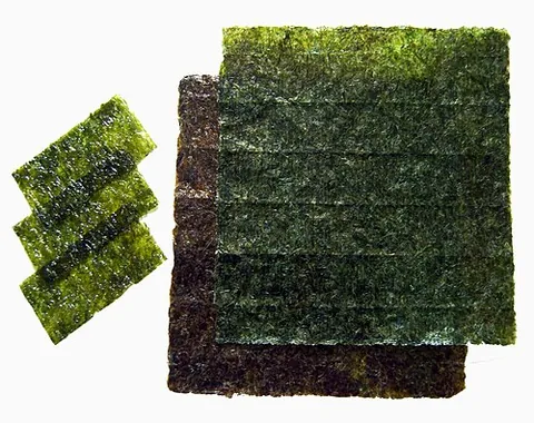 nori: a type of seaweed, a red alga, laver (genus Pyropia, including species P. yezoensis and P. tenera)