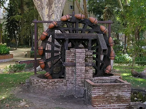 noria: a treadwheel with attached buckets, used to raise and deposit water