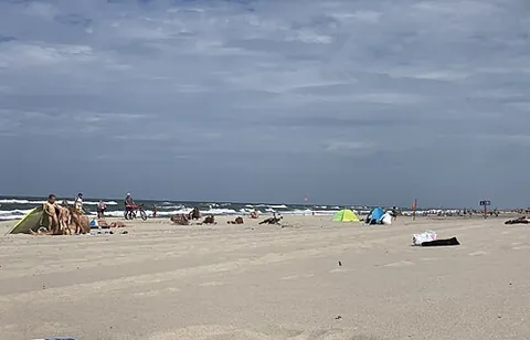 nudist beach: a beach where full nudity in public is permitted