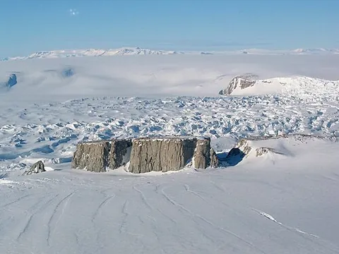 nunatak: a mountain top or rocky element of a ridge that is surrounded by glacial ice but is not covered by...