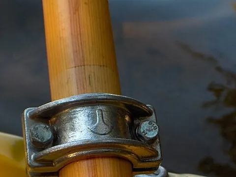 oarlock: a usually U-shaped device attached to the gunwale of a rowboat to hold the oars in place while...
