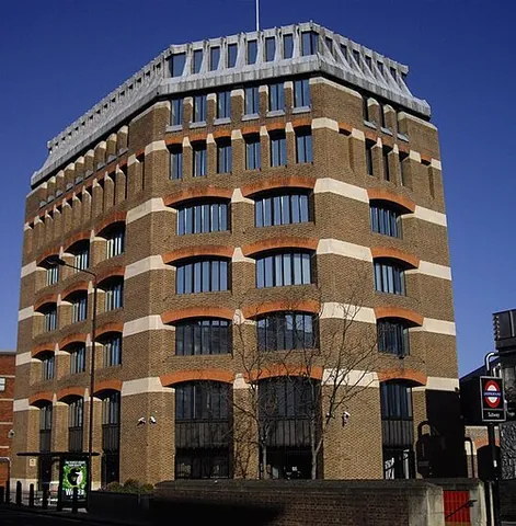 office block: a large building which contains offices on several floors, often for several firms