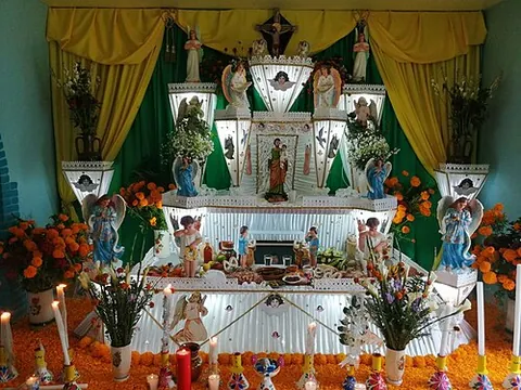 ofrenda: a shrine of offerings to one's ancestors set up on the Day of the Dead