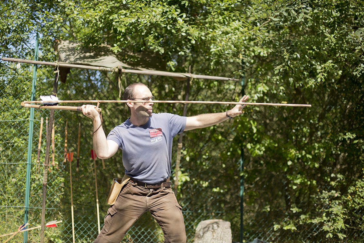 atlatl: a spearthrower consisting of a wooden stick with a thong or perpendicularly protruding hook on the...