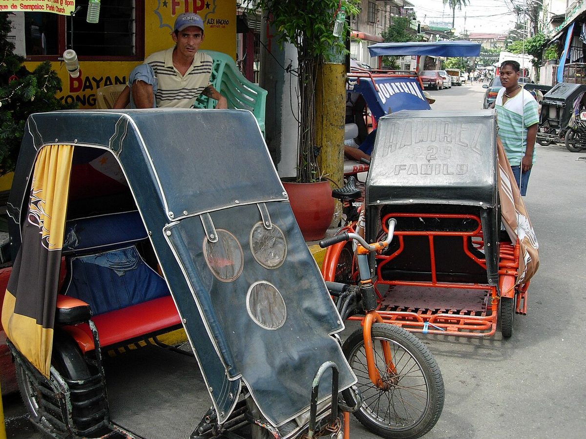 pedicab: a tricycle having a hooded cab to seat paying passengers