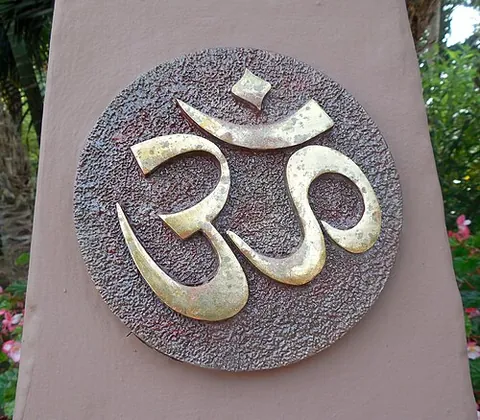 om: a sacred, mystical syllable used in prayer and meditation