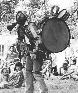 one-man band: a musician who plays several musical instruments at once