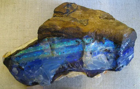 opal: a mineral consisting, like quartz, of silica, but inferior to quartz in hardness and specific...