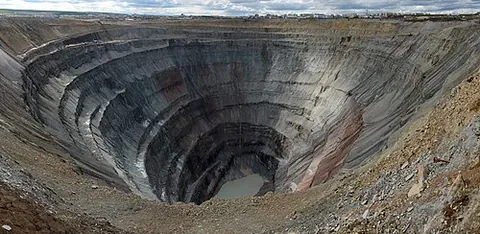 open-pit mine: a type of mine where rock or minerals are extracted from the earth by their removal from an open...