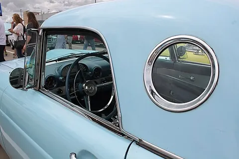 opera window: a small porthole-sized side window in the C-pillar of certain cars, popular in the 1970s
