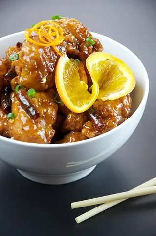 orange chicken: an American Chinese dish of Hunanese origin made with fried chicken pieces in a sweet...