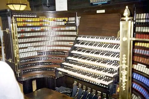 organ console: the manuals, the pedals and associated stops of an organ, especially a pipe organ