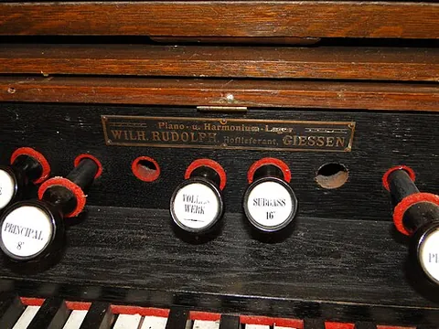 organ stop: any of many knobs near the keyboard of an organ used to select different sounds or timbres