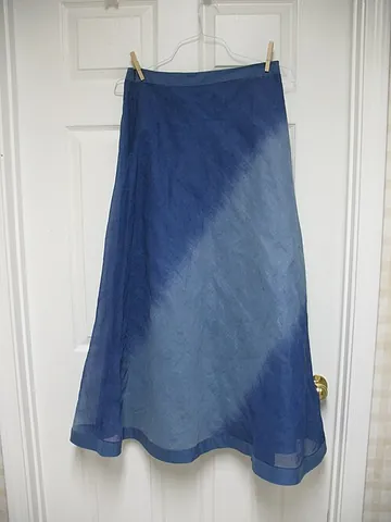 organza: a thin, stiff, sheer fabric that is made from silk or a synthetic yarn, which resembles organdy,...