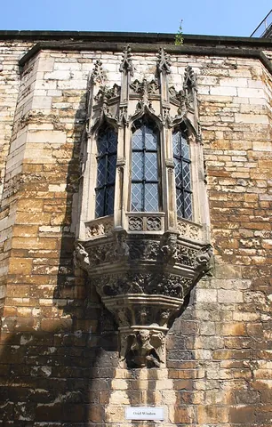 oriel: a large polygonal recess in a building, such as a bay window, forming a protrusion on the outer wall