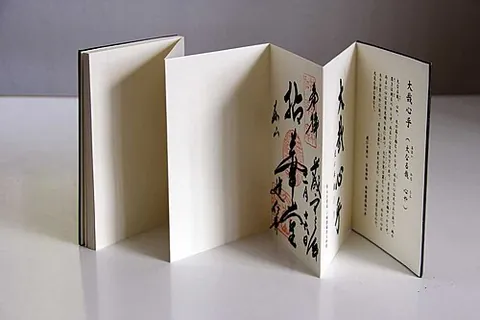 orihon: a book in the form of a long strip of paper with writing on one side, folded in zigzag fashion,...