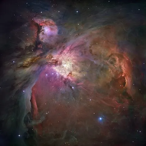 orion nebula: a diffuse nebula visible in the night sky below Orion's Belt; it is approximately 40 light years...