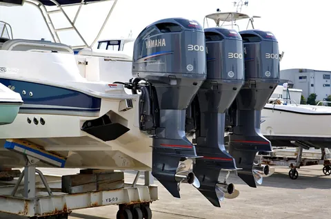 outboard motor: a detachable and pivotable propulsion unit fitted over the transom of a boat, comprising an engine...