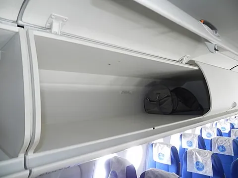 overhead bin: a compartment for luggage placed over the passangers' seat on public transport such as trains,...
