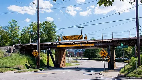overheight: higher than is standard or (transport, law, of a vehicle) higher than is allowed