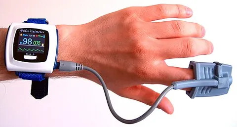 oximeter: a device that measures the quantity of oxygen in something, particularly air in the atmosphere