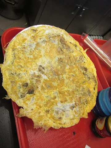 oyster cake: a Chinese oyster dish similar to an omelette or pancake, where oysters are pan-fried and caked in...