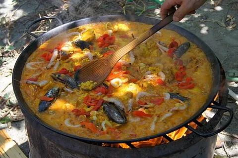 paellera: a large shallow frying pan in which paella is cooked
