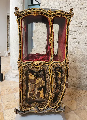 palanquin: an enclosed human-borne litter or sedan chair, a large box with a chair, couch, or bed raised on...
