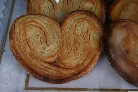palmier: a type of puff pastry biscuit made in the shape of a palm leaf and rolled in sugar