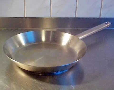 pan: a wide, flat receptacle used around the house, especially for cooking